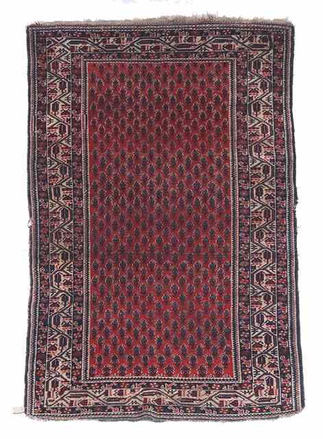 Appraisal: A HAMADAN RED GROUND RUG with continuing boteh decoration within