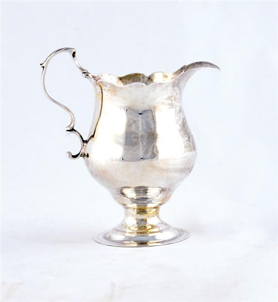 Appraisal: George III silver creamer London circa pear shaped with scroll