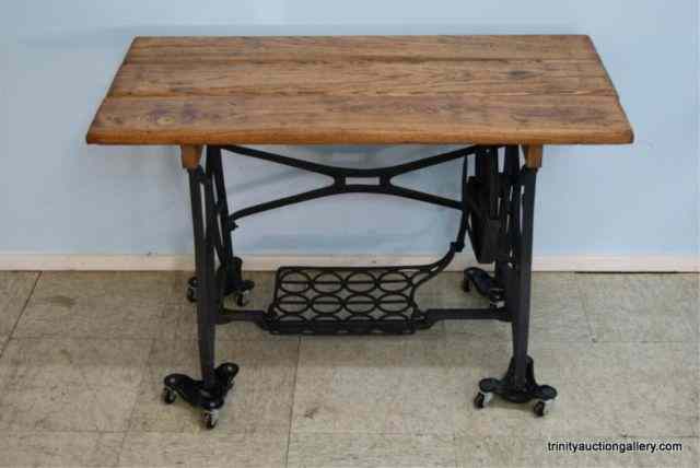 Appraisal: Primitive Coffee Table Cast Iron Base Oak TopThis is for