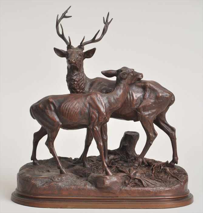 Appraisal: A DUBUCAND STAG AND DOE Bronze incised signature oval base