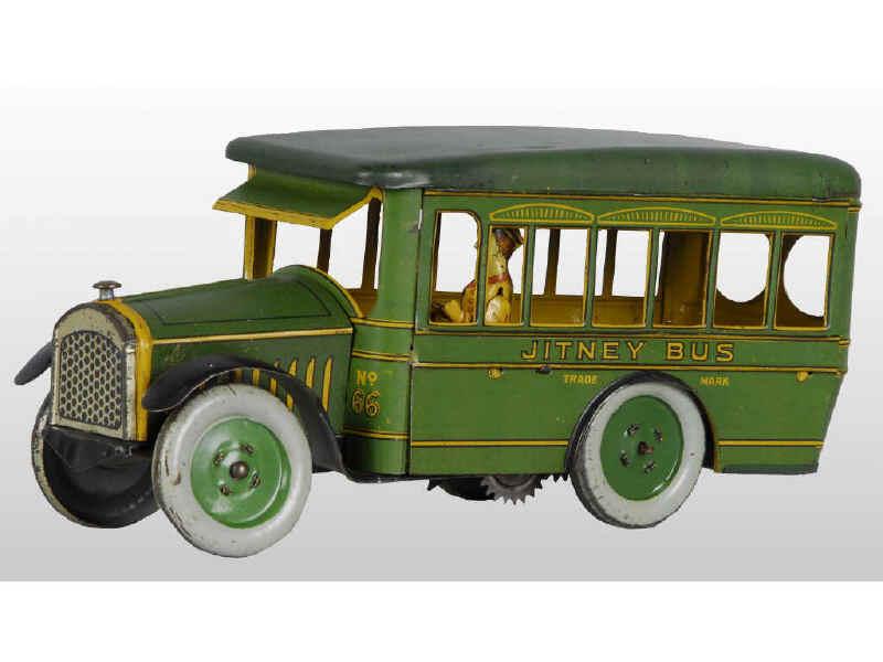 Appraisal: Strauss Tin Wind-Up Jitney Bus Toy Description Working Includes original