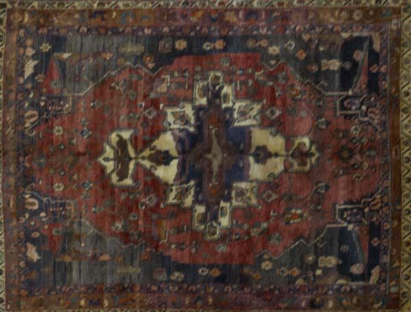 Appraisal: PERSIAN Area rug with cinnamon field x