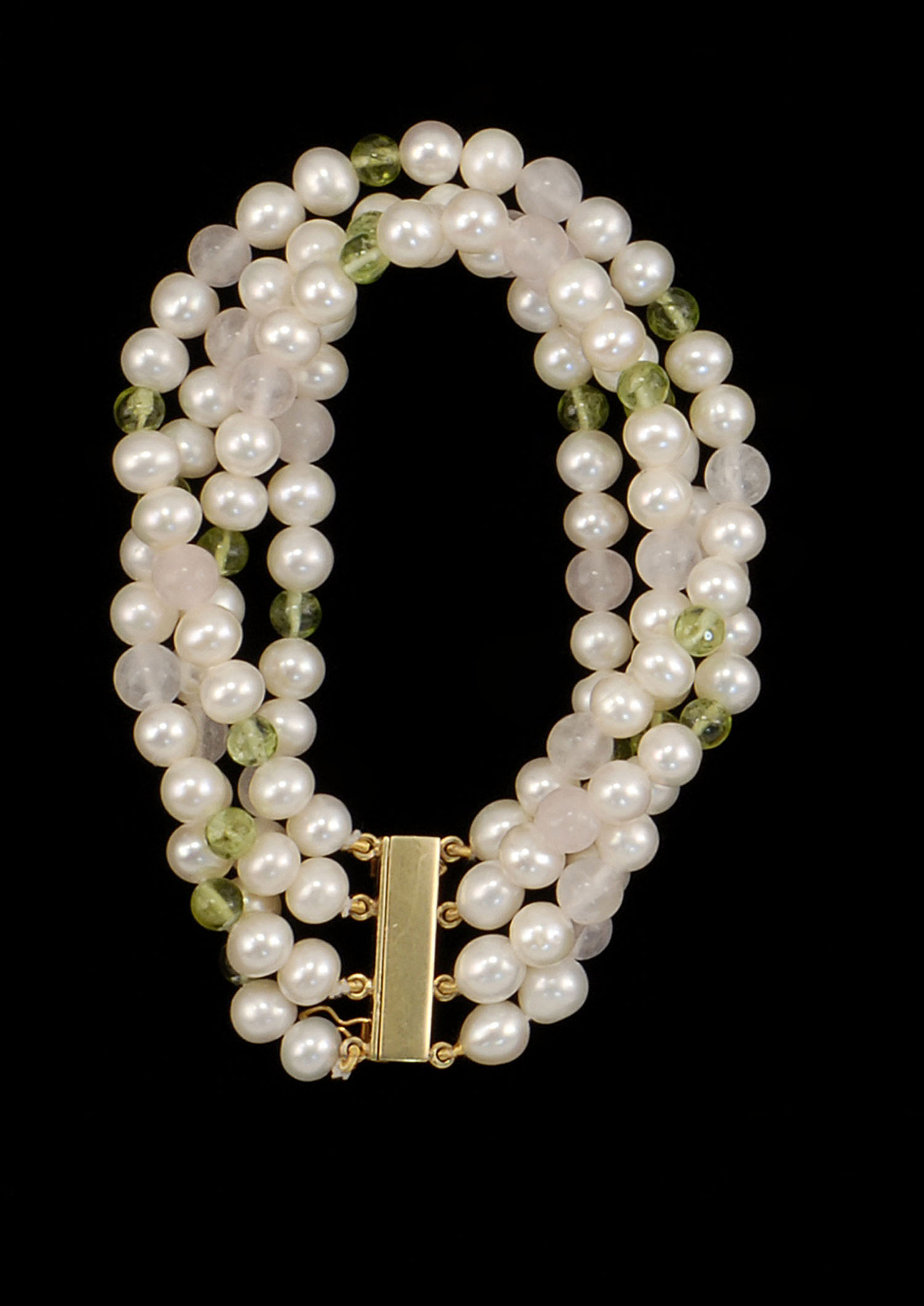 Appraisal: FOUR-STRAND PEARL BRACELET WITH KT GOLD CLASP Pearls interspersed with