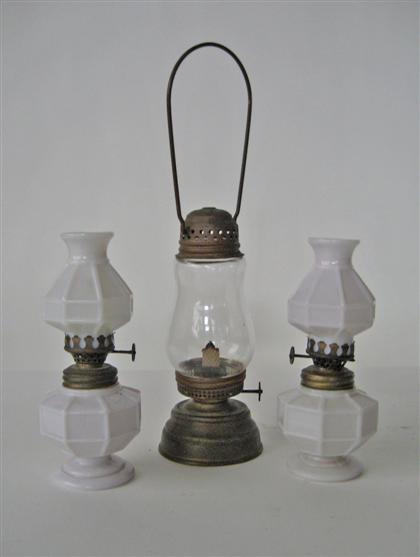 Appraisal: Pair white milk-glass lamps th century together with a brass