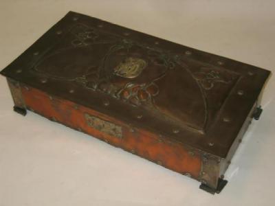 Appraisal: AN ARTS AND CRAFTS COPPER AND SILVER PLATED CASKET of