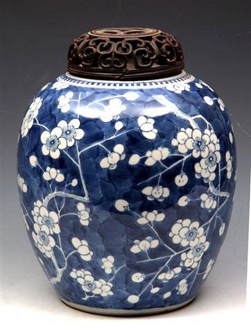 Appraisal: A CHINESE BLUE AND WHITE GINGER JAR and pierced wooden