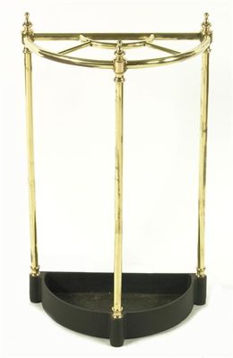 Appraisal: A turned brass and cast iron demi-lune stick stand with