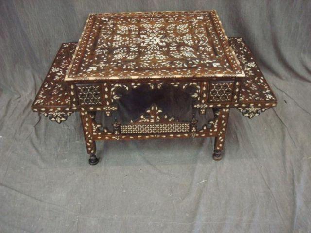 Appraisal: Mediterranean Style Table Carved Inlaid with Mother-of-Pearl Some pieces of