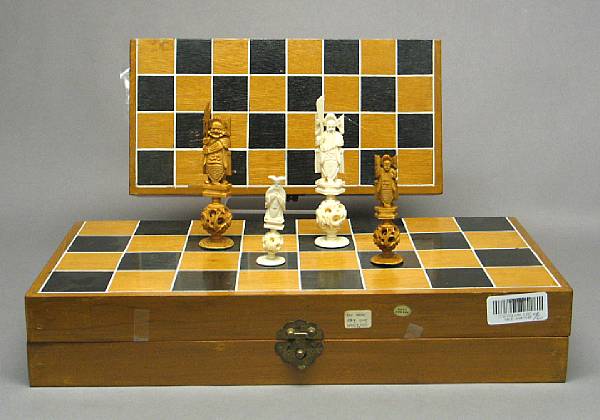 Appraisal: Two tinted ivory chess sets th Century The larger set