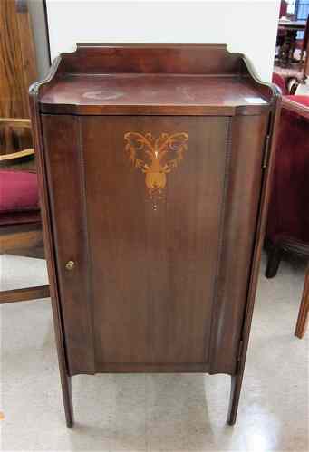 Appraisal: AN INLAID MAHOGANY MUSIC CABINET American c having three interior