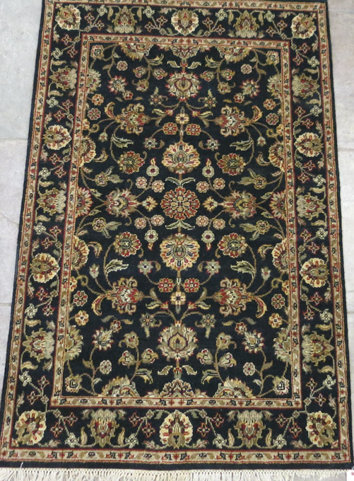 Appraisal: HAND KNOTTED ORIENTAL AREA RUG Indo-Persian overall floral decoration on