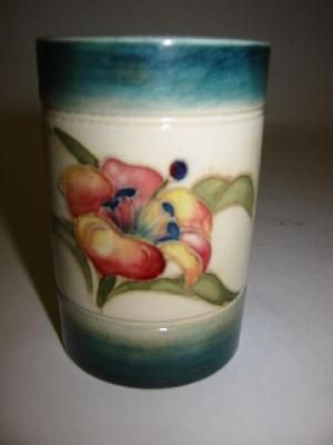 Appraisal: A MOORCROFT POTTERY SMALL CYLINDRICAL VASE tube lined and painted