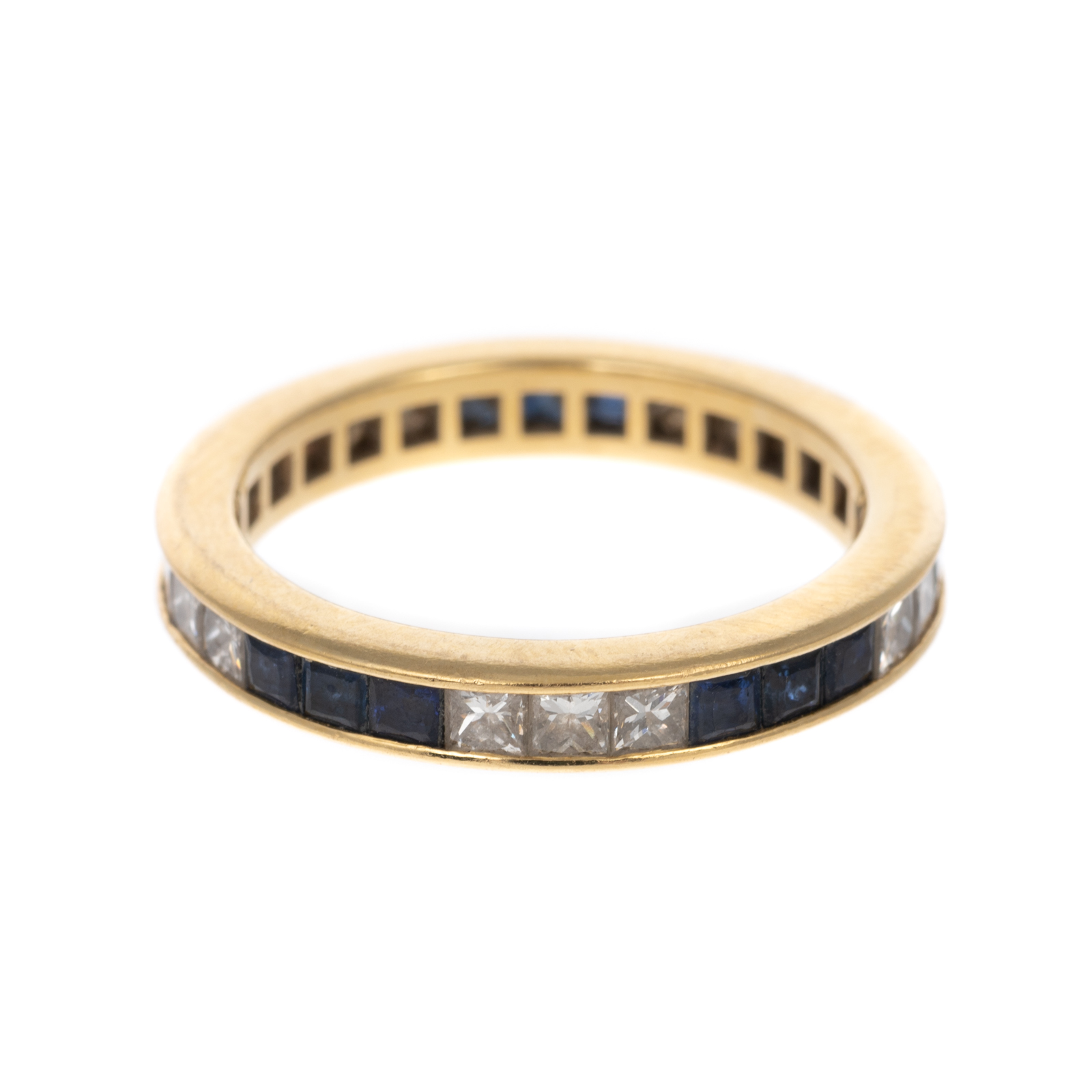 Appraisal: A SAPPHIRE DIAMOND ETERNITY BAND IN K K yellow gold