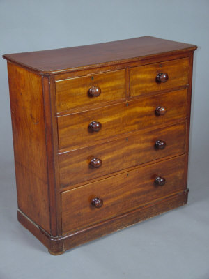 Appraisal: A Victorian mahogany round corner chest of drawers with two