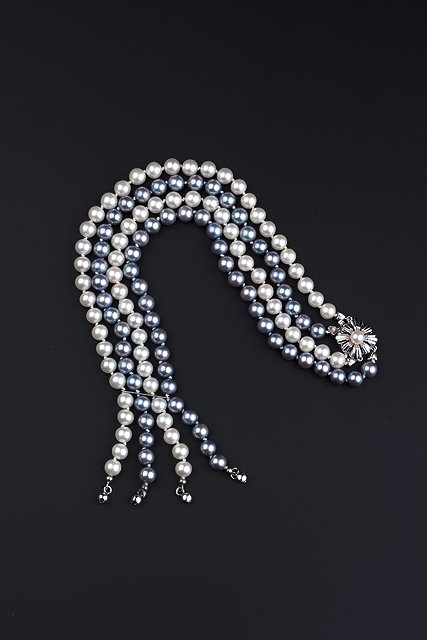 Appraisal: A DOUBLE STRAND CULTURED PEARL NECKLACE comprising uniform pearls of