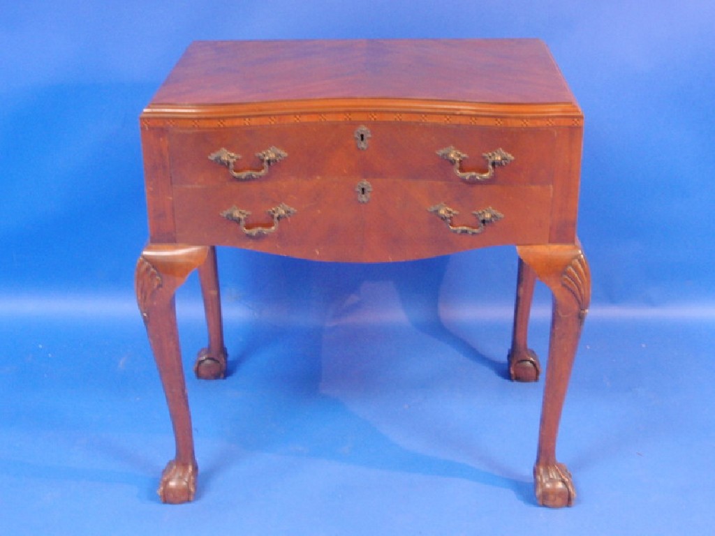 Appraisal: A walnut serpentine cutlery chest on cabriole legs