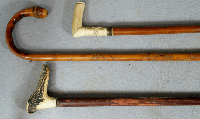 Appraisal: walking sticks c o Japanese carved bamboo stag horn and