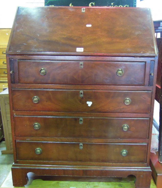 Appraisal: A reproduction mahogany bureau in the Georgian style the fall