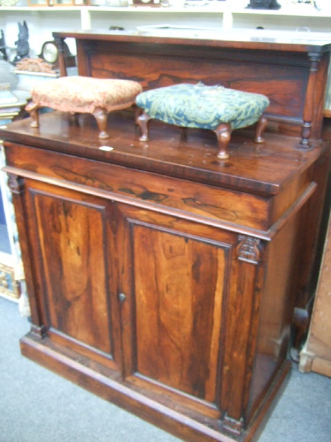 Appraisal: A Regency rosewood chiffonier the ledge back on turned supports