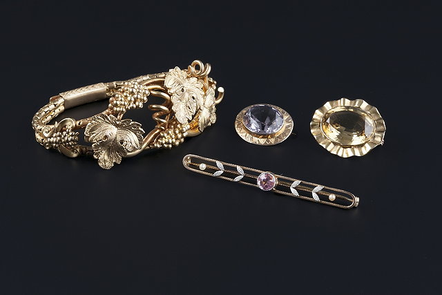 Appraisal: Three gem set brooches and a bracelet comprising a pink