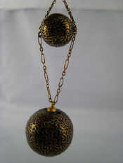 Appraisal: An inlaid pique ball pendant largest ball approx mm diameter