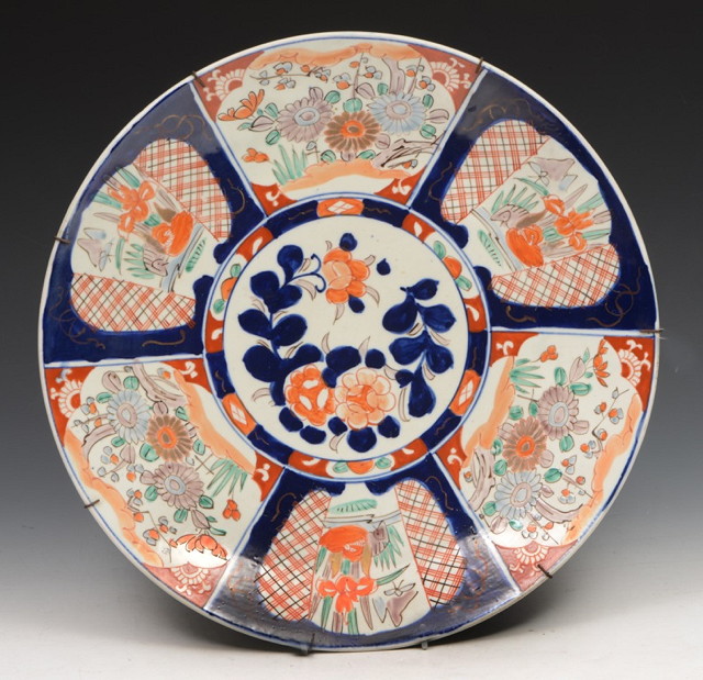 Appraisal: A JAPANESE IMARI CIRCULAR CHARGER with iron red and cobalt