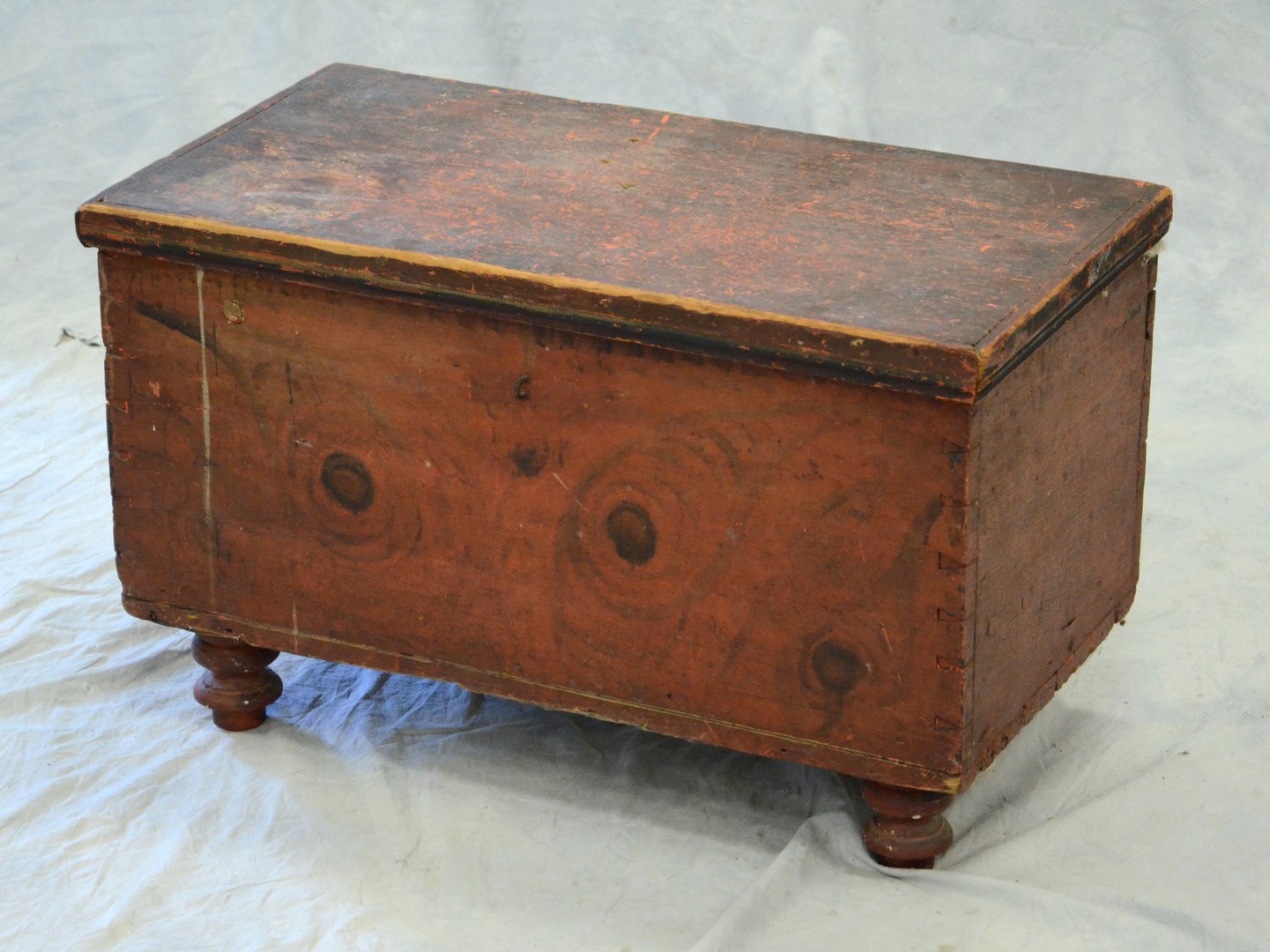 Appraisal: Red black painted diminutive primitive pine blanket chest - h