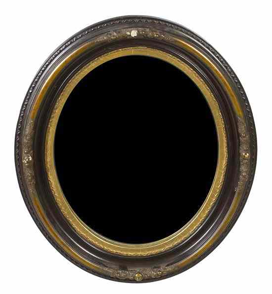 Appraisal: A Victorian Parcel Gilt Mirror having an oval plate within