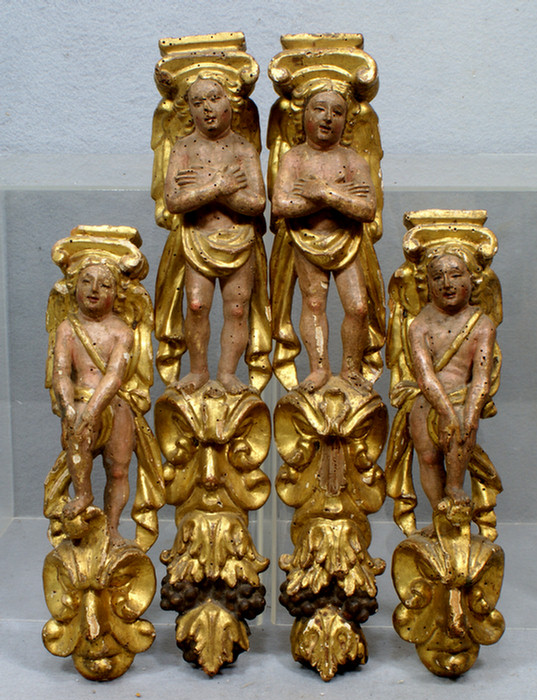 Appraisal: matched pairs of carved painted and gilt wood figural appliques