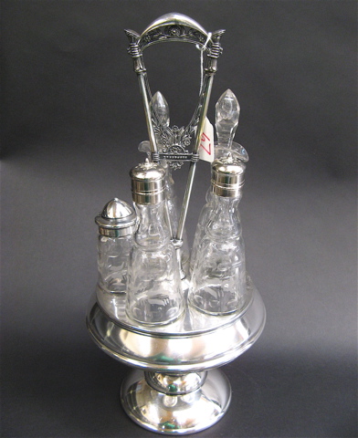 Appraisal: AN AMERICAN SILVER PLATED CASTOR SET having etched glass bottles