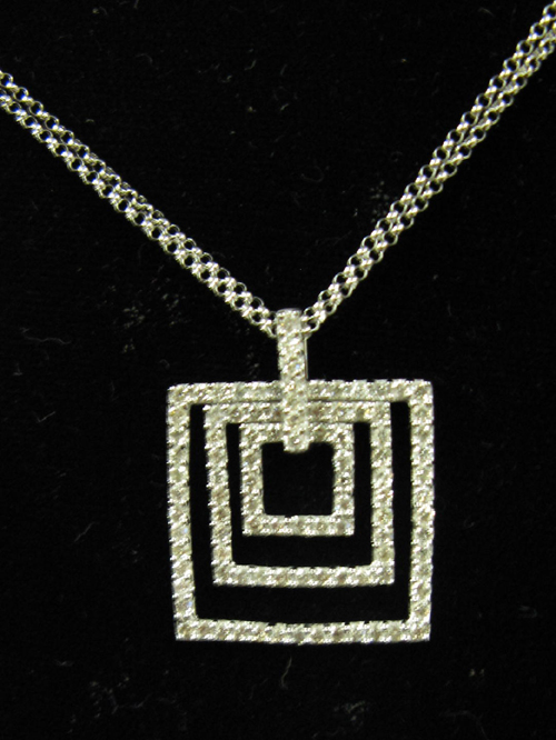 Appraisal: DIAMOND AND FOURTEEN KARAT WHITE GOLD PENDANT NECKLACE The pendant