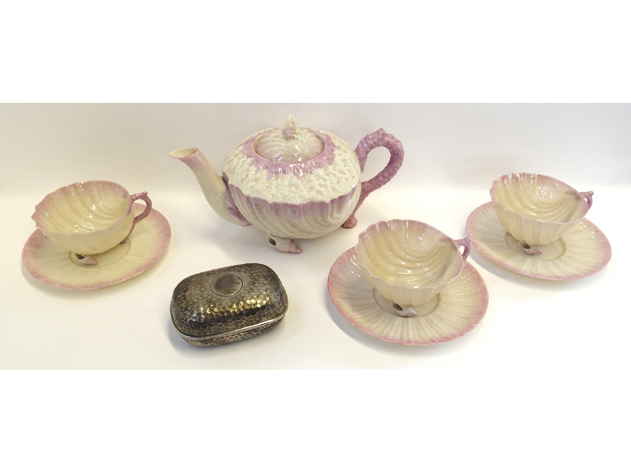 Appraisal: Belleek shell teapot and three cups and saucers together with