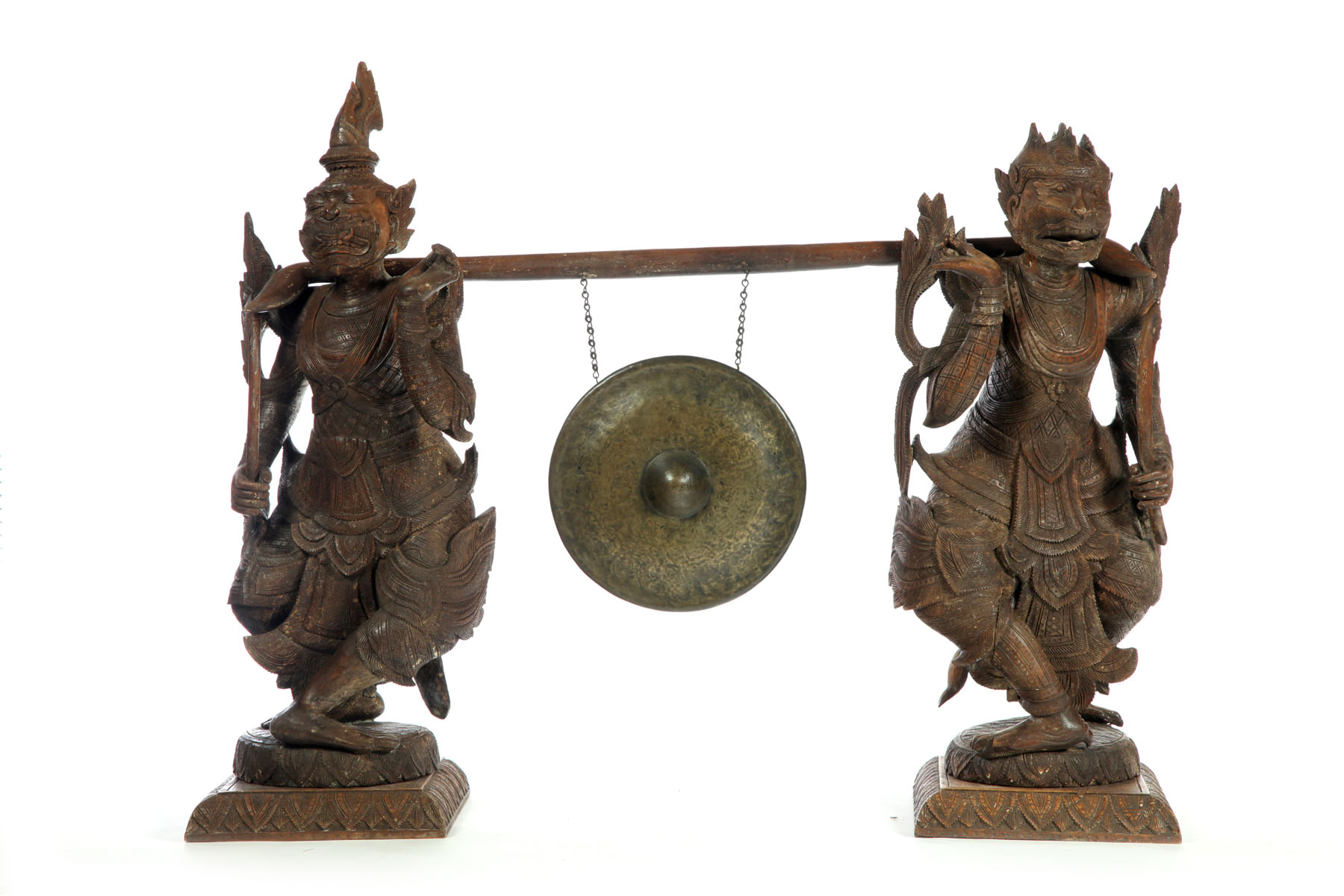 Appraisal: GONG IN FIGURAL STAND Indonesia th century hardwood Brass gong