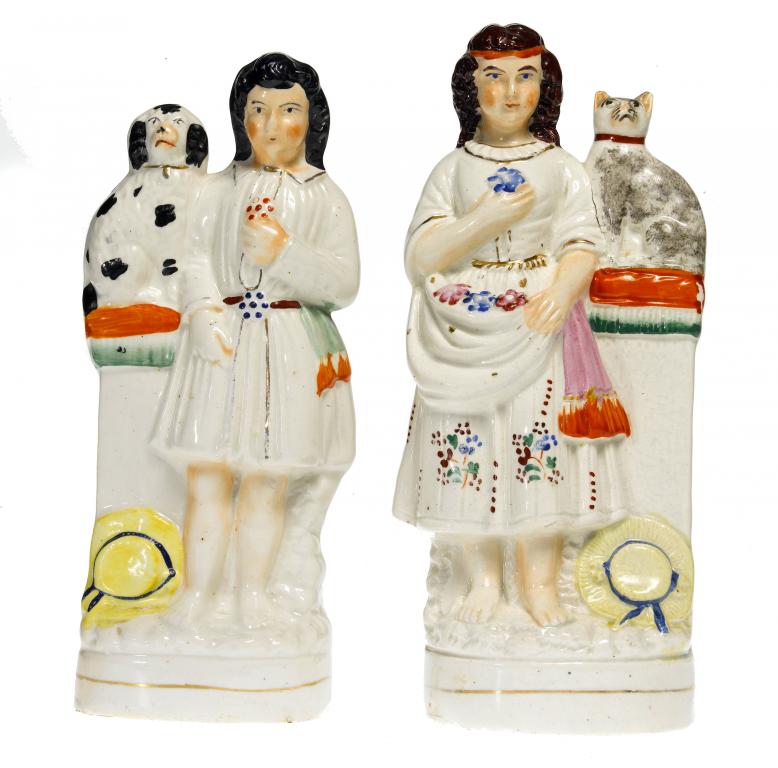 Appraisal: A PAIR OF STAFFORDSHIRE FIGURES OF A BOY AND GIRL