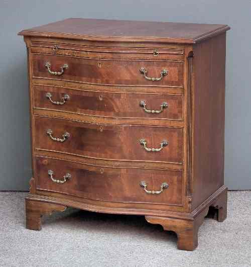 Appraisal: A modern mahogany serpentine fronted chest of drawers of Georgian