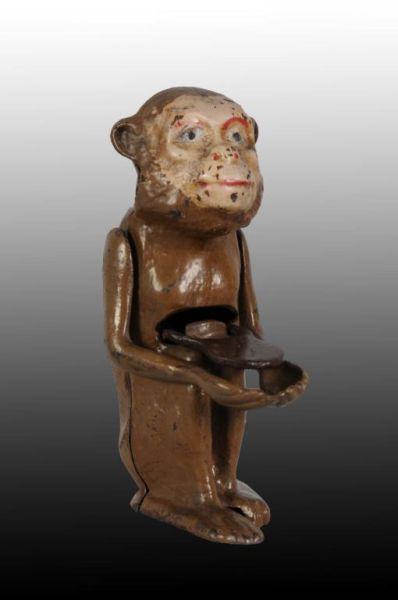 Appraisal: Cast Iron Monkey with Tray Mechanical Bank Description Replaced tray