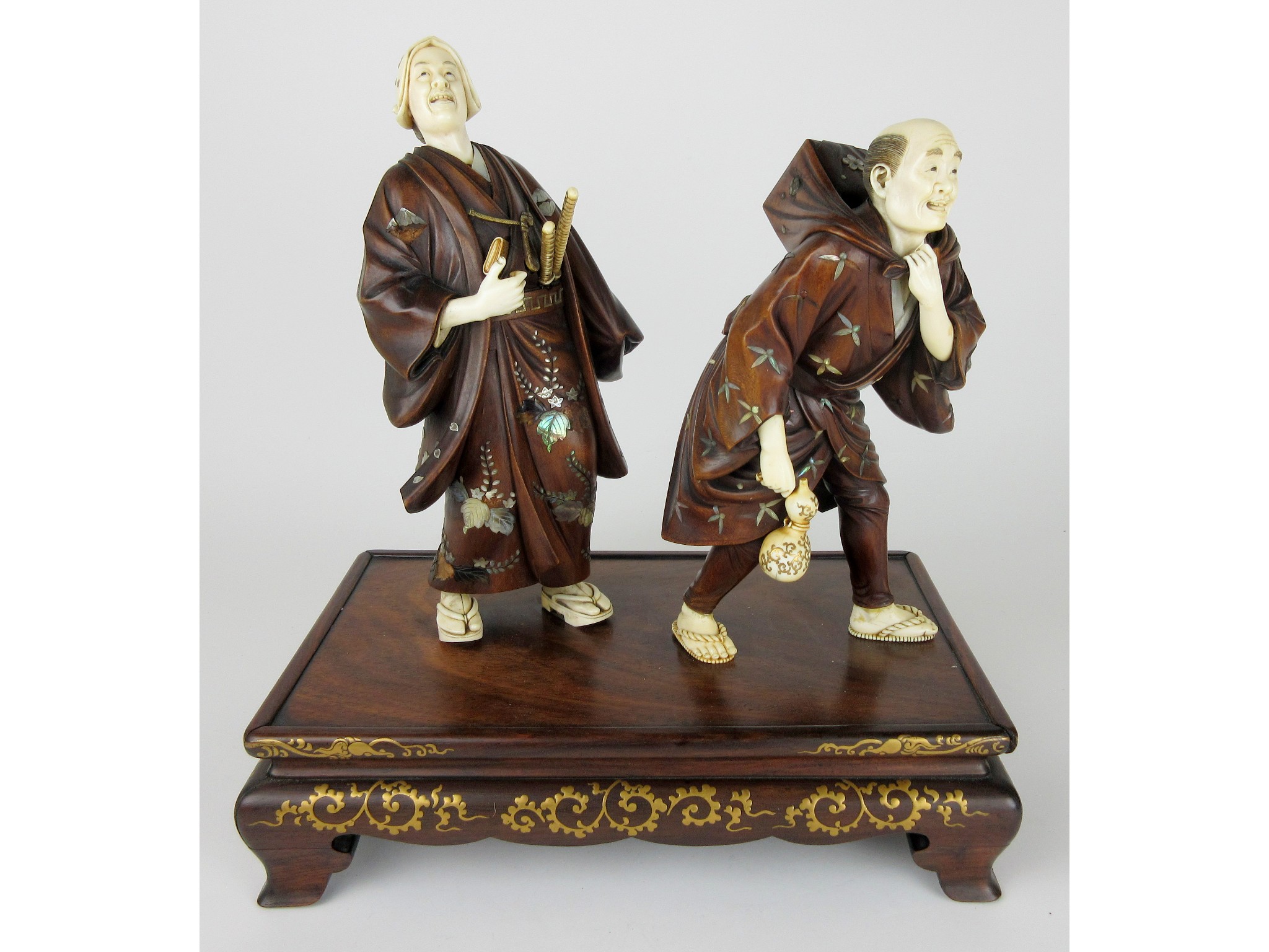 Appraisal: A Japanese Shibayama ivory and wood group of a Samurai