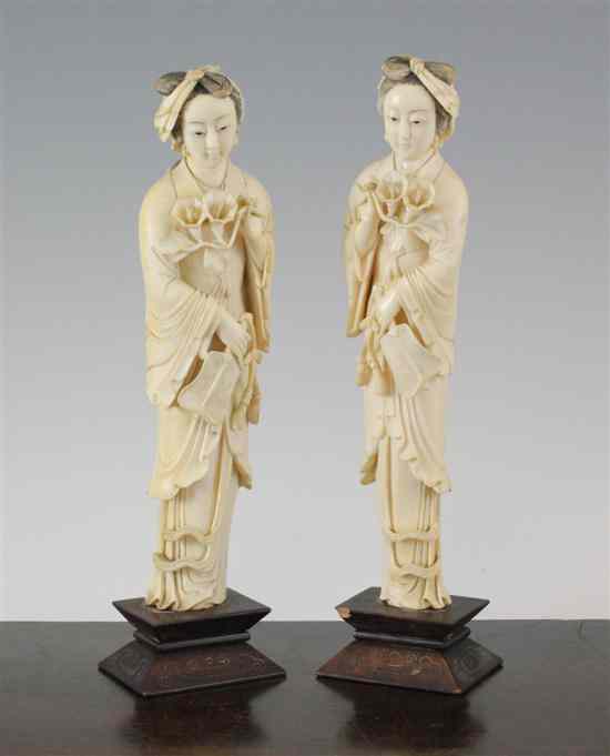 Appraisal: A pair of Chinese ivory figures of ladies early th