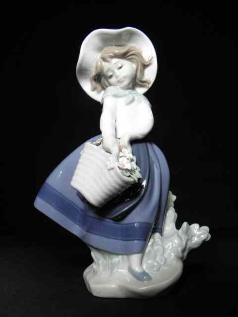 Appraisal: Lladro porcelain figurine titled ''Pretty Pickings'' Marked on base ''Lladro