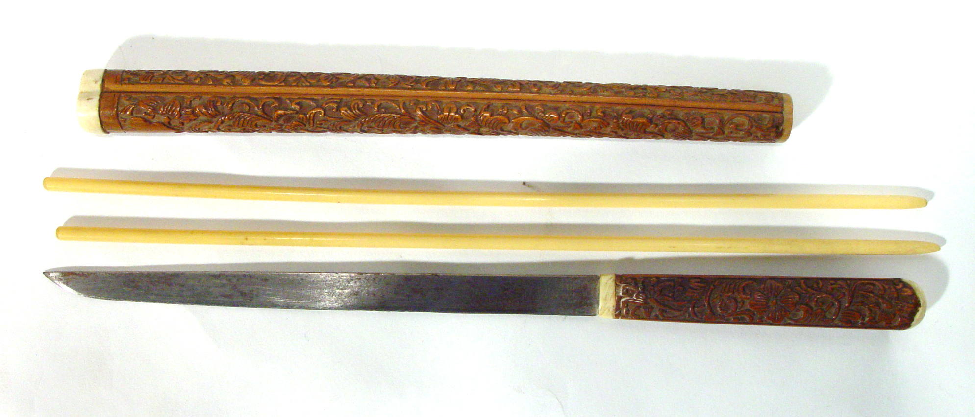 Appraisal: Oriental carved hardwood chopstick case with ivory chopsticks and wooden