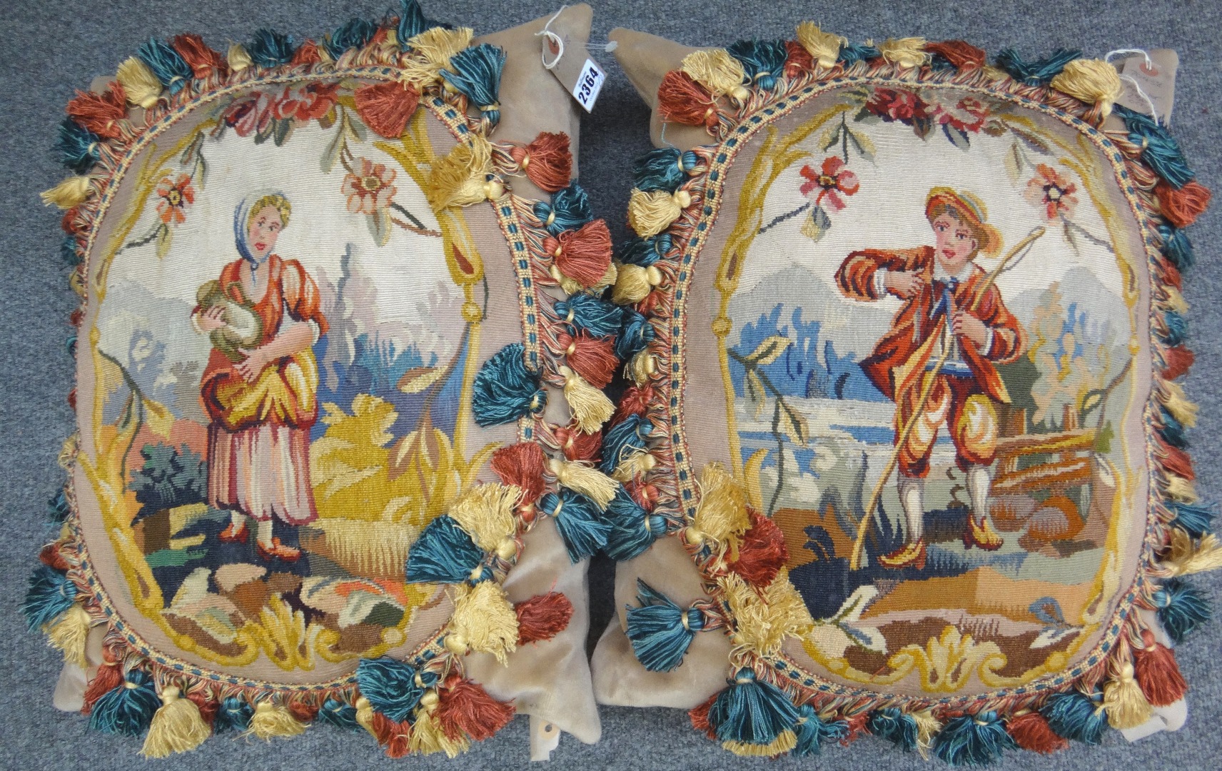 Appraisal: A pair of cushions with a tapestry panel of a