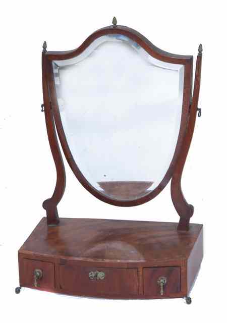 Appraisal: A TH CENTURY MAHOGANY SHIELD SHAPED SWING DRESSING TABLE MIRROR