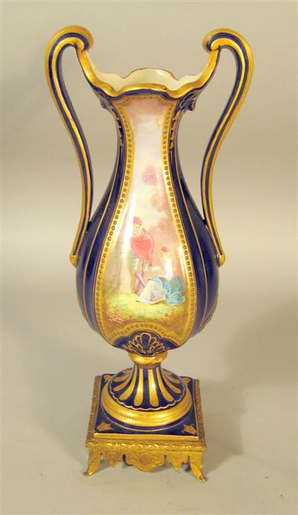 Appraisal: Sevres style 'jewel' mounted porcelain urnOf slim baluster form with