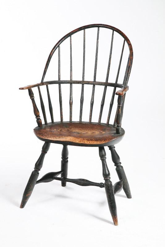 Appraisal: WINDSOR ARMCHAIR American th century pine Sack-back chair with baluster