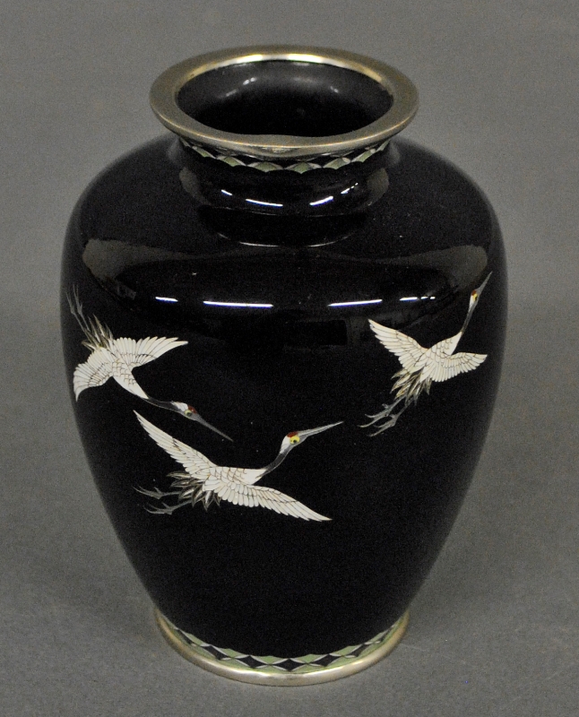 Appraisal: - Japanese cloisonn vase on a black reserve with flying