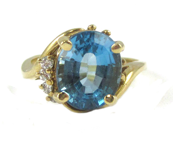 Appraisal: BLUE TOPAZ DIAMOND AND FOURTEEN KARAT GOLD RING set with