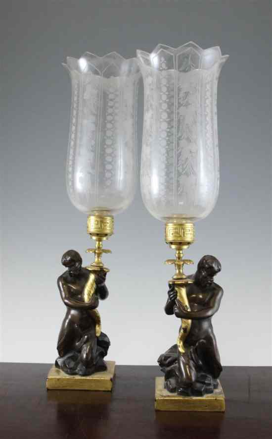 Appraisal: A pair of bronze glazed and gilt ceramic lamps in