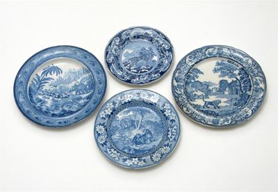 Appraisal: Four blue and white plates printed with scenes of lions