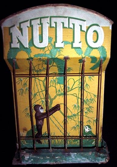 Appraisal: Nutto a performing monkey in a cage cm high