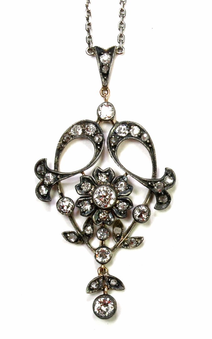 Appraisal: A late Victorian diamond set pendant pierced with floral foliate